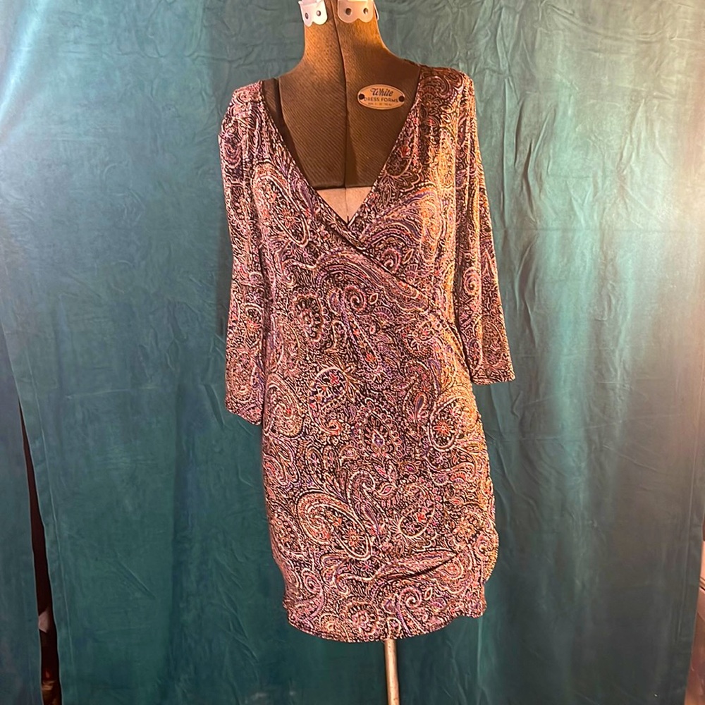 Salaam wrap top with a black, purple, beige, and red paisley design. Beautiful!